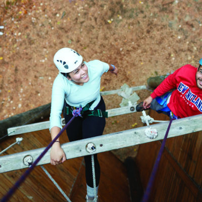 Female student tackles NEC's ropes course